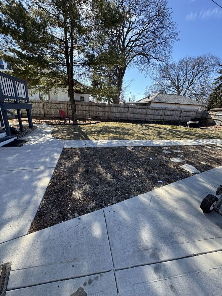 Curb and yard cleared after 708 JUNK hauled the junk away